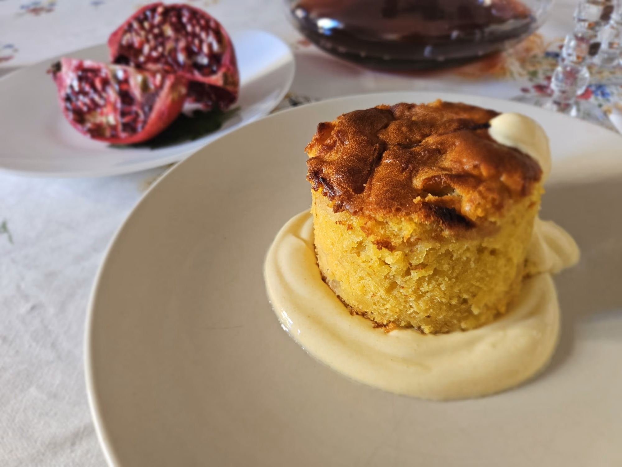 Warm apple and polenta cake on a pool of crème anglaise