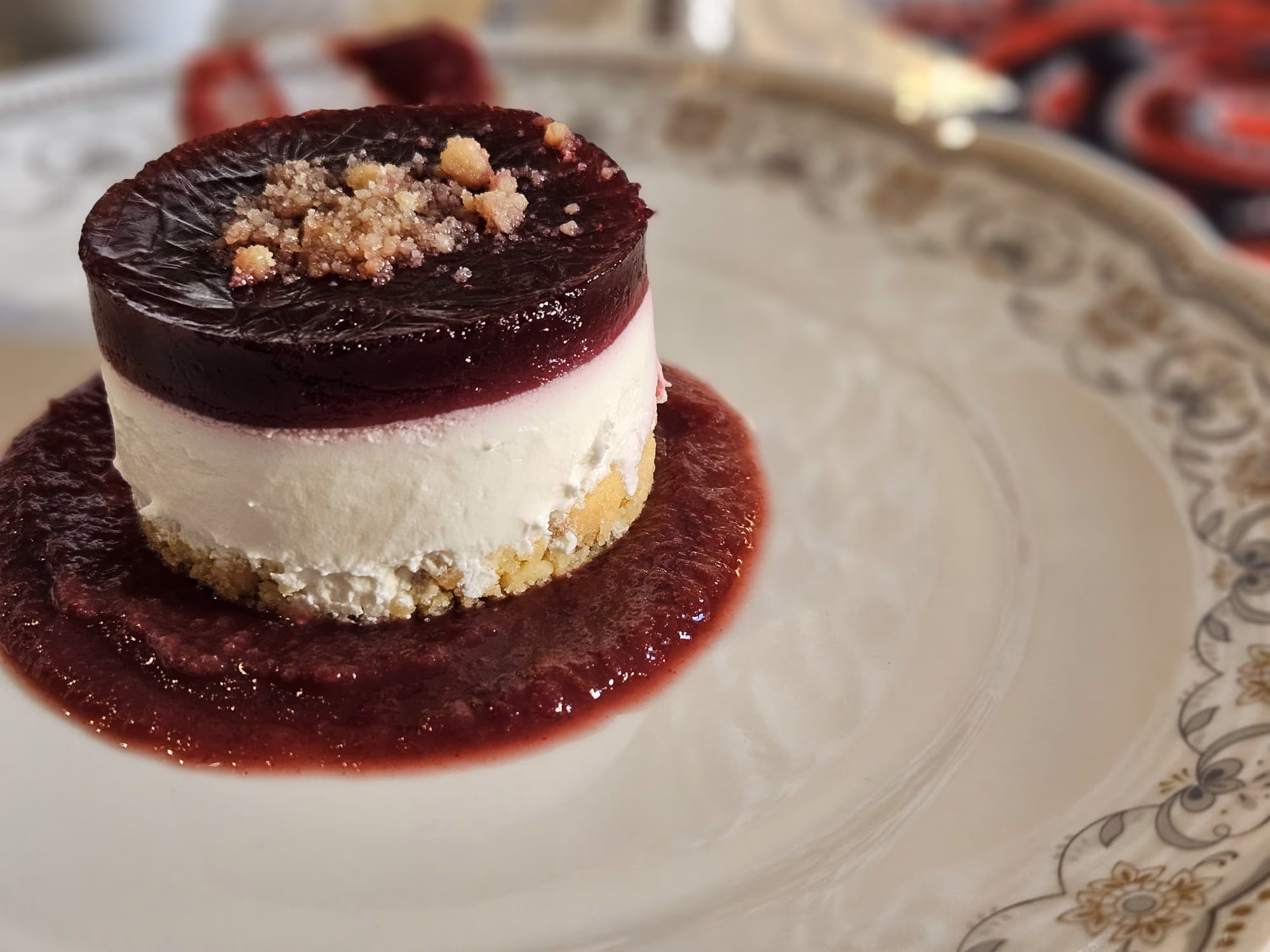 Cheesecake with a berry jelly top and berry sauce